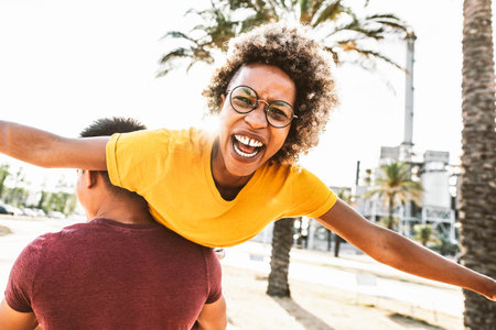 Afro american woman enjoying freedom outside on summer vacationの写真素材