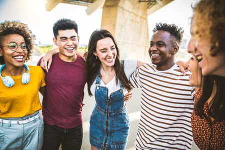 Multiracial friends group having fun on city streetの写真素材
