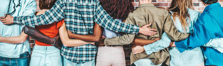 Back view of group of diverse people hugging each otherの写真素材