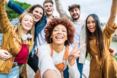 Multiracial group of friends taking selfie pic outside