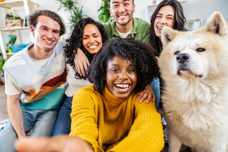 Multiracial group of friends with dog taking selfie picture togetherの写真素材