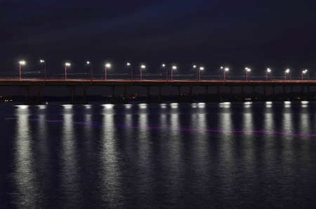 Night river landscape, illuminated bridge over the Dnieper river.の写真素材