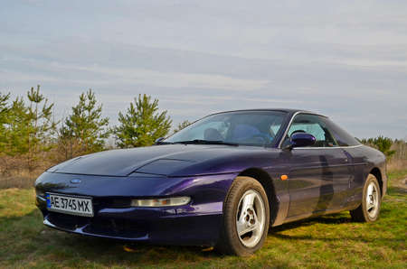 Ukraine, Novomoskovsk 04.11.2021. Beautiful sports car Ford Probe 2 in a pine forest.のeditorial素材
