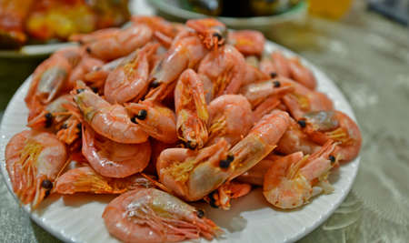 Delicious boiled sea shrimps with lemon.
