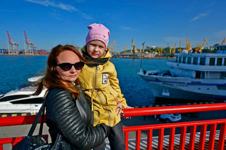 Child girl with mom on a boat trip.の写真素材