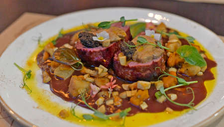 Duck breast with delicious sauce, restaurant serving.