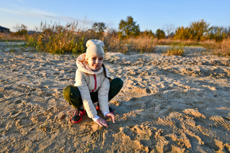 Mother and child are walking along the river bank.の写真素材