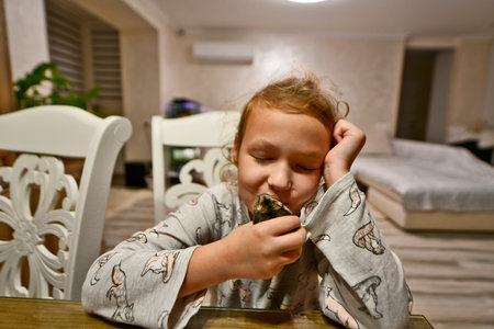 Child girl with her pet in her arms, Djungarian hamster.の写真素材