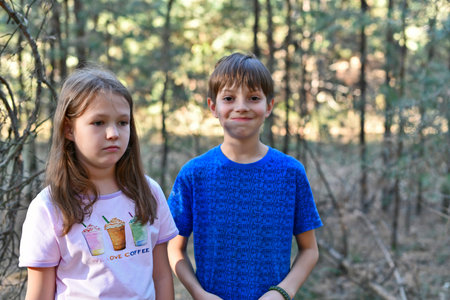 Families relax outside the city in a pine forest in autumn, celebrate birthdays, eat vegetables and...