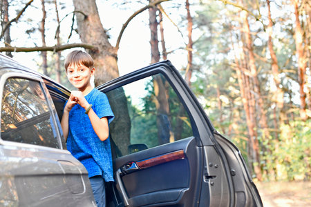 Families relax outside the city in a pine forest in autumn, celebrate birthdays, eat vegetables and salads. Play active games.の写真素材