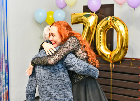 A family celebrates their father's 70th birthday.の写真素材