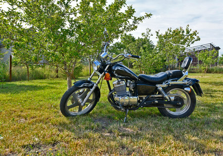 A chopper is a type of motorcycle. It features radically modified steering angles and longer forks, making it appear more elongated.の写真素材