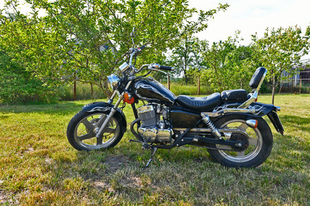 A chopper is a type of motorcycle. It features radically modified steering angles and longer forks, making it appear more elongated.の写真素材