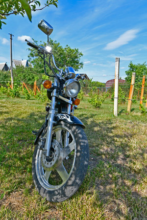 A chopper is a type of motorcycle. It features radically modified steering angles and longer forks, making it appear more elongated.の写真素材