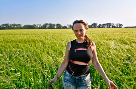 Beautiful women, family pick beautiful wild flowers in the field in summer.