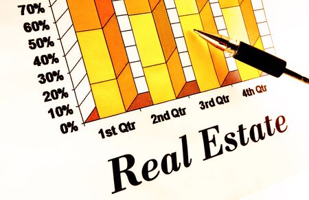 Real estate chart with pointing penの写真素材