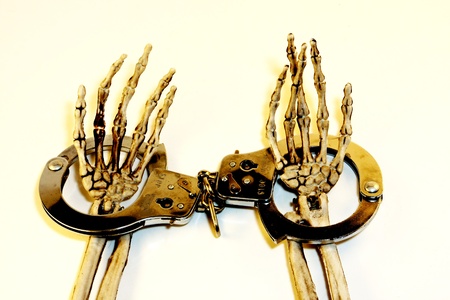 Skeleton hands in handcuffsの写真素材
