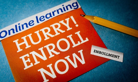Hurry online learning enroll now with a pencilの写真素材