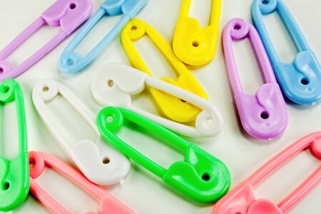 Baby safety pins colored blue,green,white,purple and pinkの写真素材