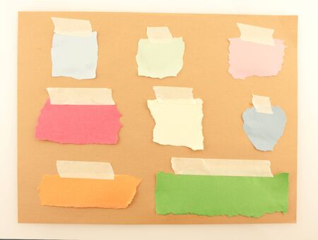 Background of colored papers attached with tapeの写真素材