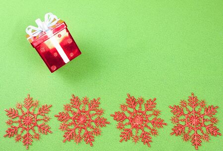 Four red star with box Christmas background over greenの写真素材