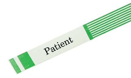 A patient green hospital  bracelet isolated on whiteの写真素材