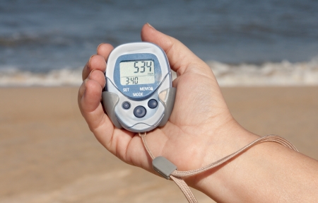 Pedometer In A Hand On The Beachの写真素材