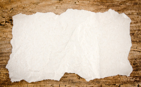 A blank white paper on a wooden backgroundの写真素材