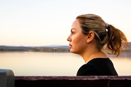Young female relaxing outside in tranquil natureの写真素材