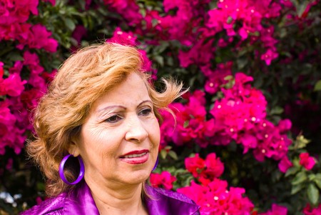 grandmother lady smiling outdoors portraitの写真素材