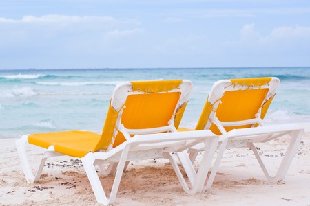 Beach relaxing chairs in caribbean cancun