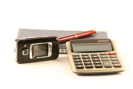 The pen, notebook, the calculator and mobile phone
