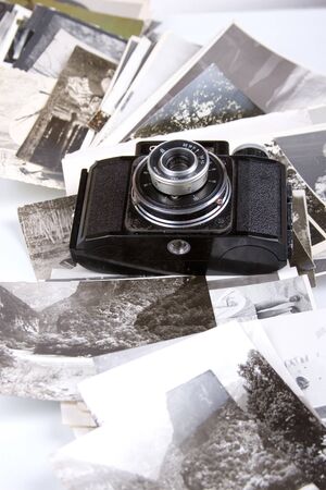 Old camera and pictures on a white backgroundの写真素材