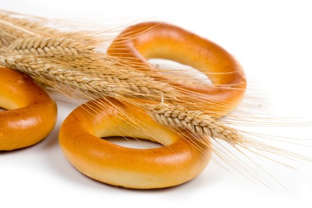 Fresh bread with ears of wheat  on a white backgroundの写真素材