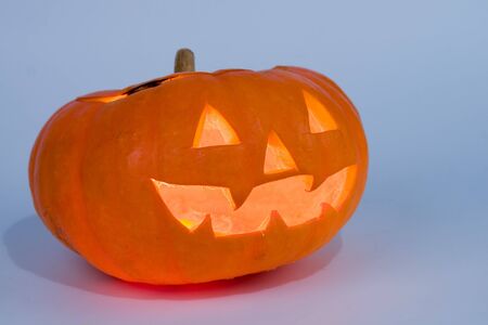 Halloween pumpkin on a blue backgroundの写真素材