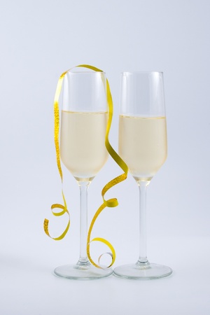 Two glasses of champagne on a light backgroundの写真素材