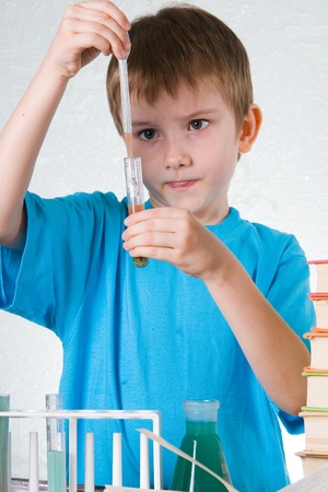 Boy plays in the academic chemist の写真素材