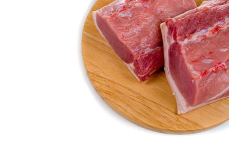 Fresh meat on a wooden board on white background