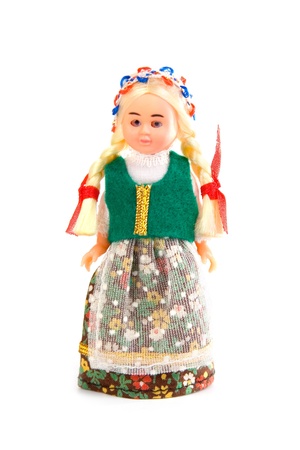 Doll in the Polish national costume on a white backgroundの写真素材