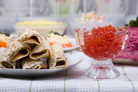 Pancakes with red caviar on a plate.The celebration of Maslenitsa - Russian religious and folk holiday.の写真素材
