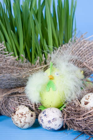 Easter still life with quail eggs on a blue background