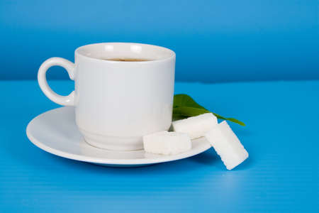 Tea with sugar on a blue backgroundの写真素材