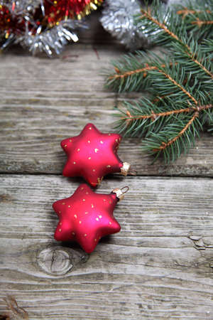 Christmas decorations. Stars and garland on a wooden background
