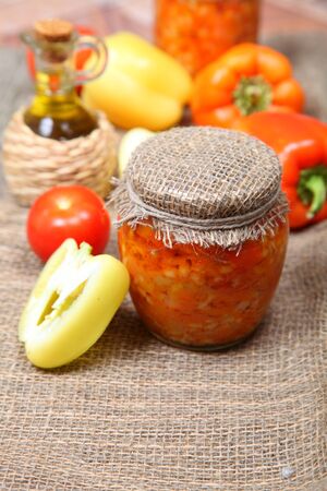 Canning vegetables in the bank on wooden backgroundの写真素材