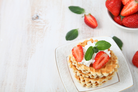 Waffles and ripe strawberries. Delicious summer dessert.の写真素材