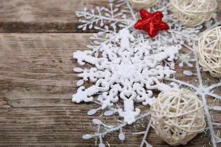 White snowflakes on an old wooden background. Christmas composition.の写真素材