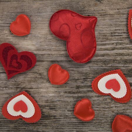 Hearts on an old wooden background. Valentine's Day card.