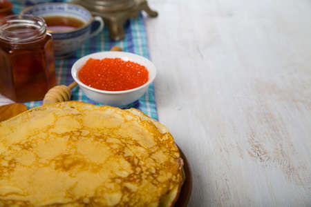 Pancakes with red caviar on a table. Shrovetide.の写真素材