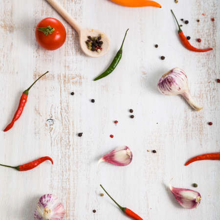 Vegetables and spices on a light wooden backgroundの写真素材