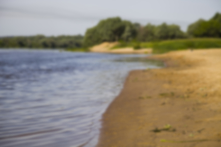 Beautiful landscape with a river and a sandy beach on a summer day.の写真素材